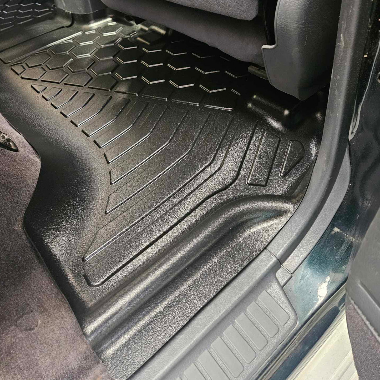 Rear set of MUDTAMER floor mats installed in a Toyota Landcruiser 80 Series