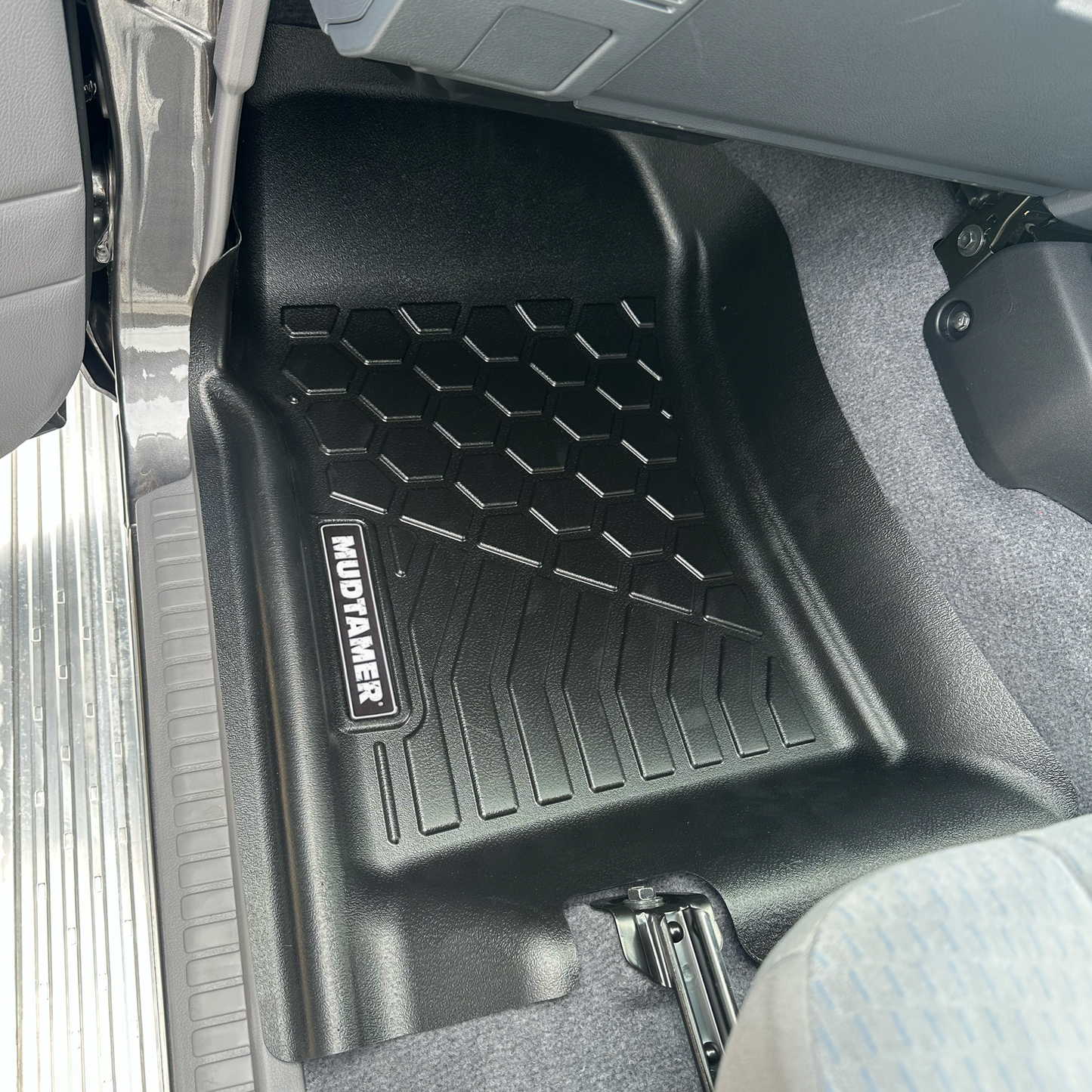 MUDTAMER passenger side floor mat installed in a Toyota Landcruiser 79 Series Dual Cab