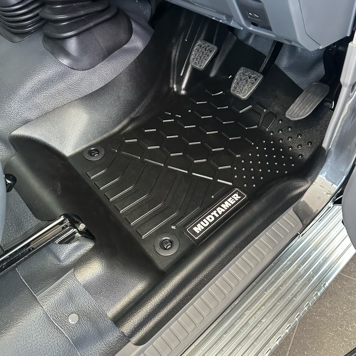 MUDTAMER driver's side floor mat installed in a Toyota Landcruiser 79 Series Dual Cab